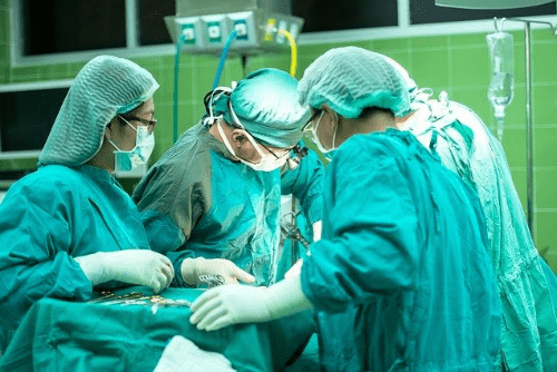a group of doctors operating on a patient