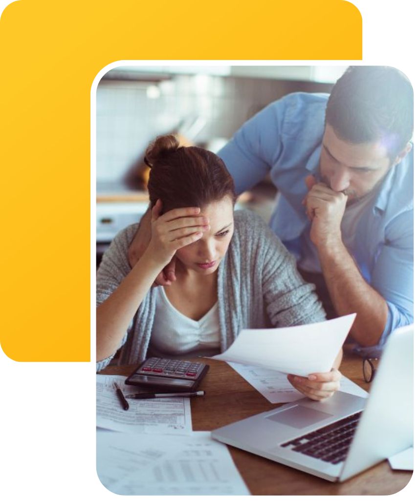 denied claims a couple looking over denied workers comp claims at the kitchen table